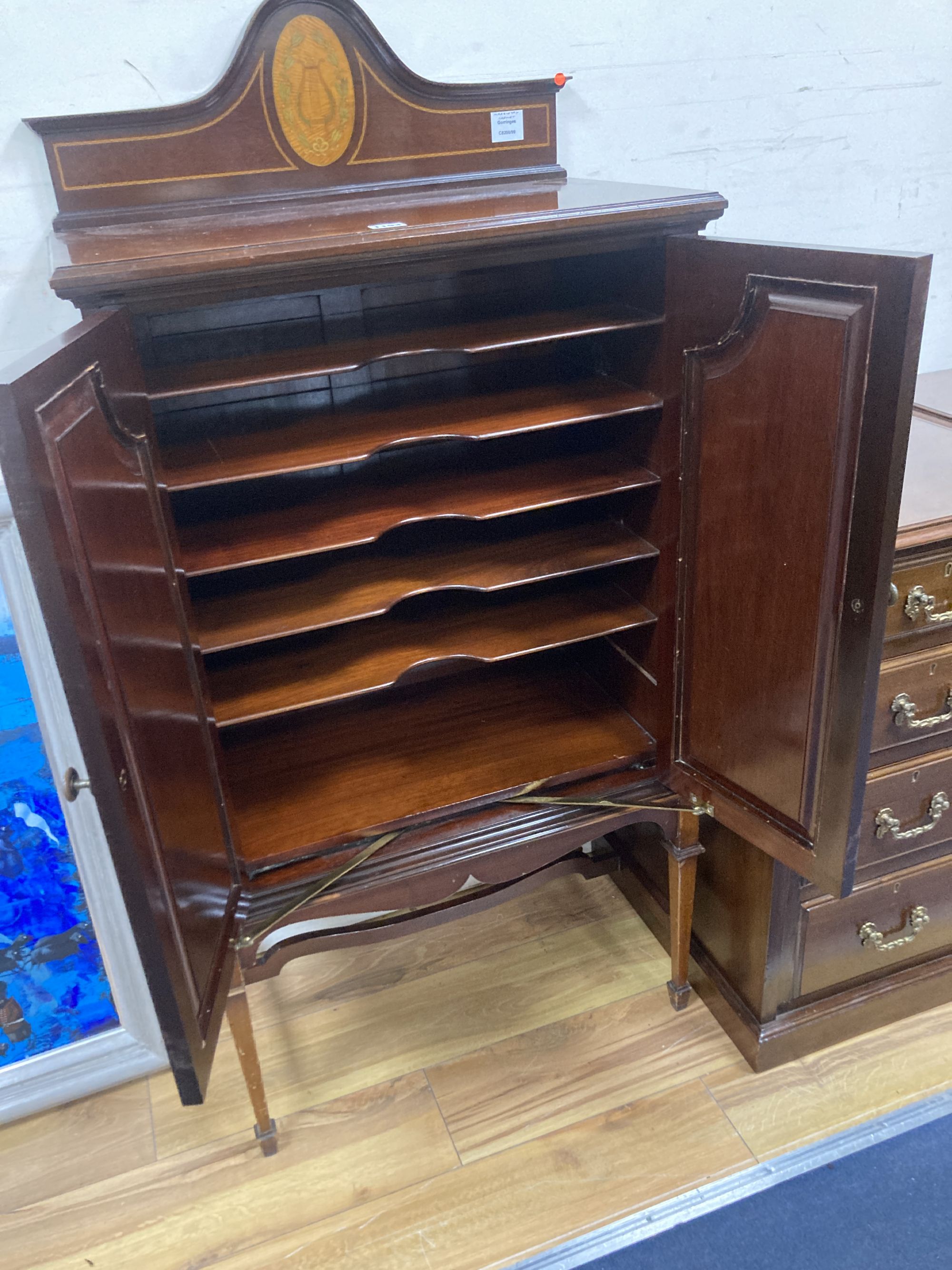 A Sheraton revival mahogany and marquetry music cabinet (later stand?), width 64cm, depth 37cm, height 130cm